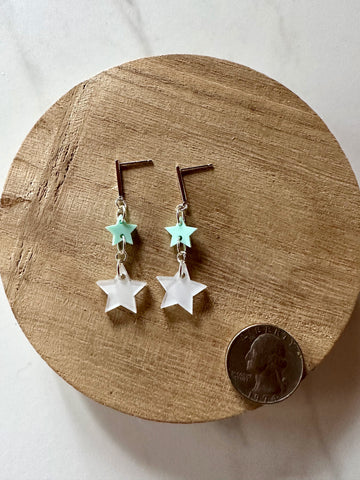 green and white star dangle earrings