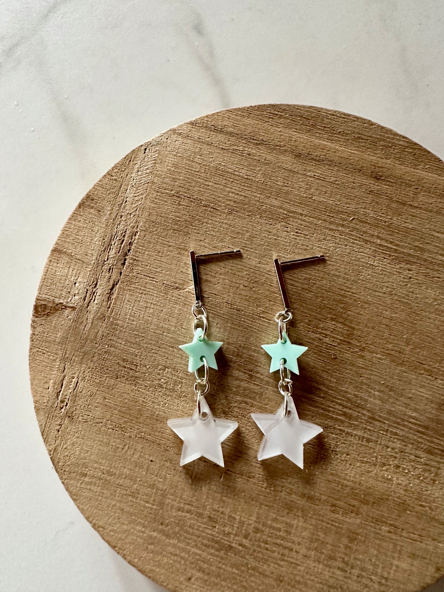 white and green star dangle earrings