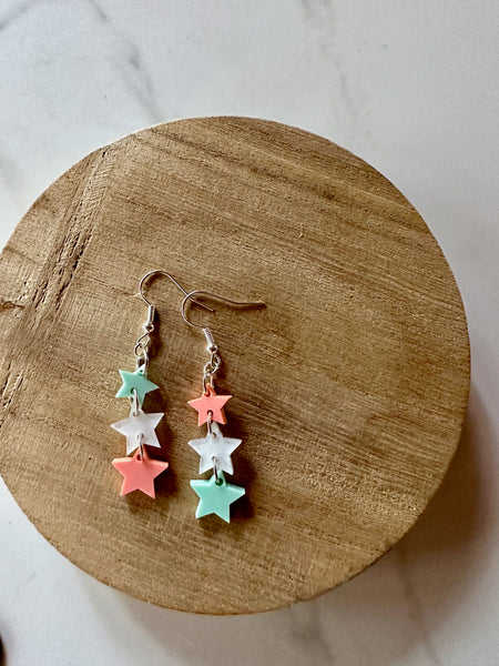 green and pink star dangle earrings