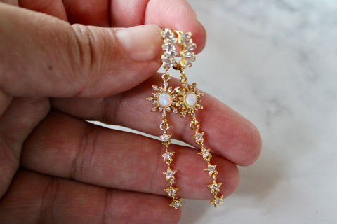 gold opal sunburst dangle earrings