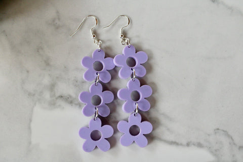 purple daisy dangle earrings