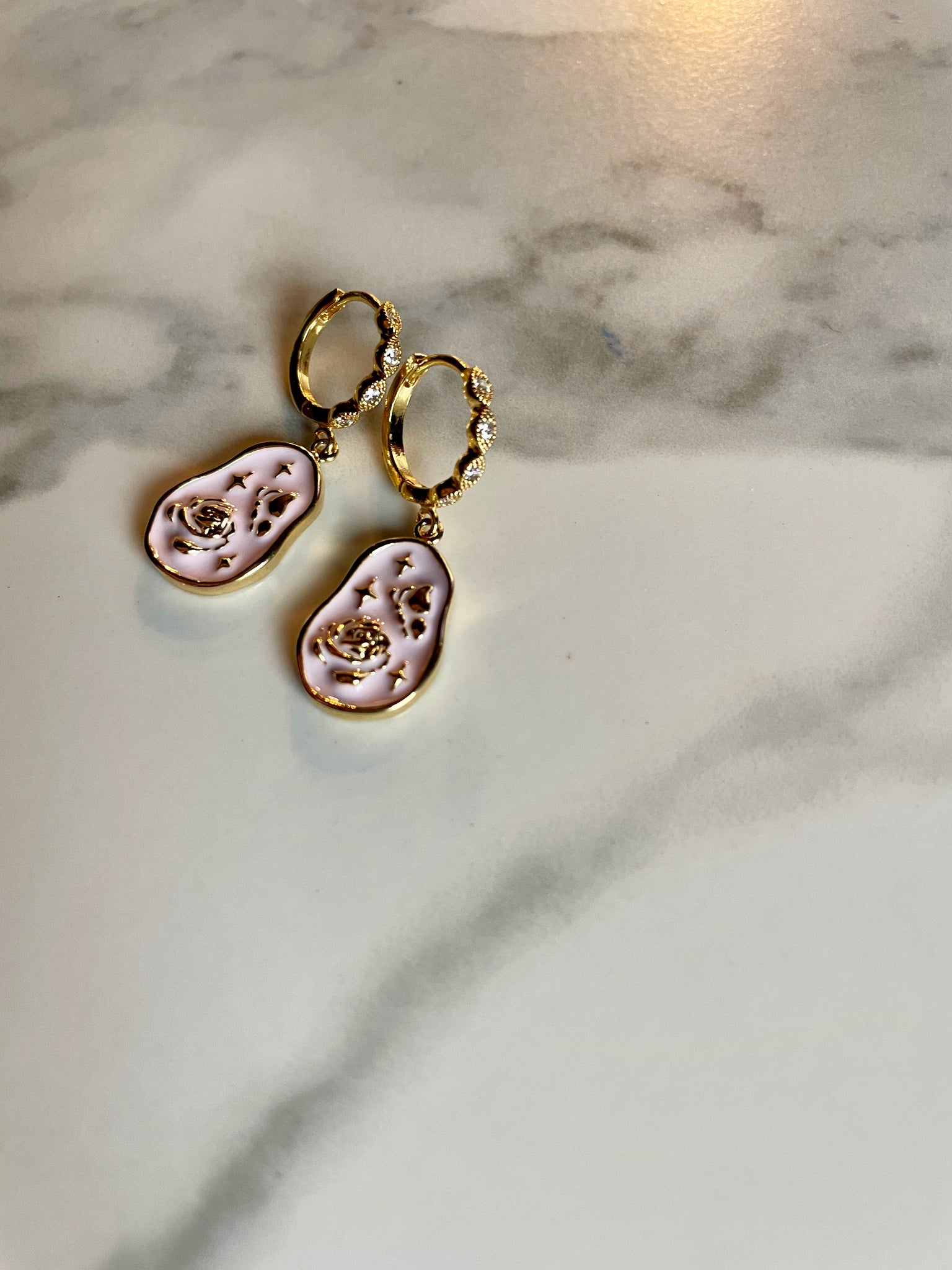 pink gold huggie earrings
