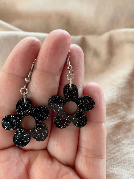 small black glitter acrylic daisy dangle earrings