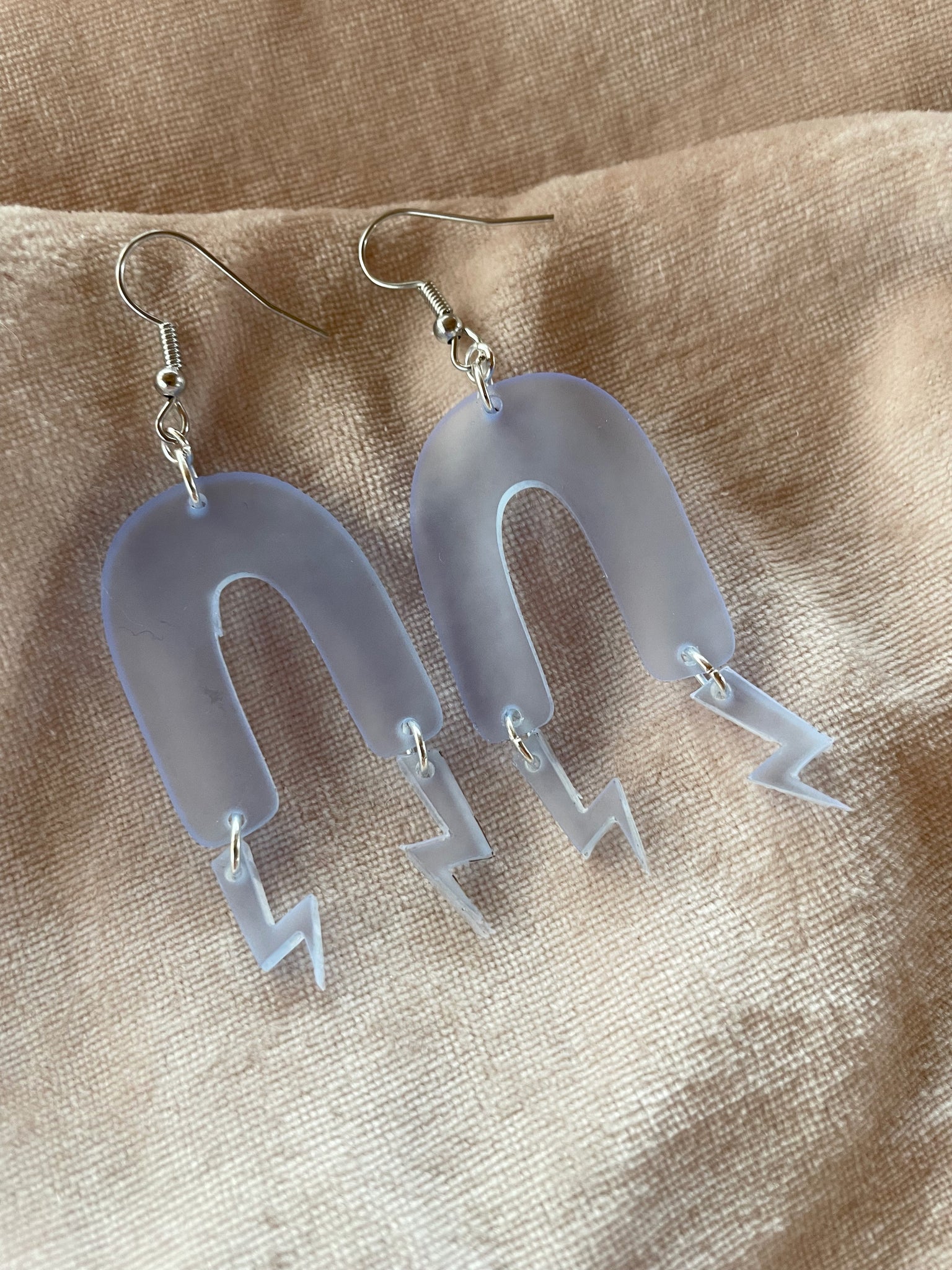 opaque blue arch lightning bolt earrings