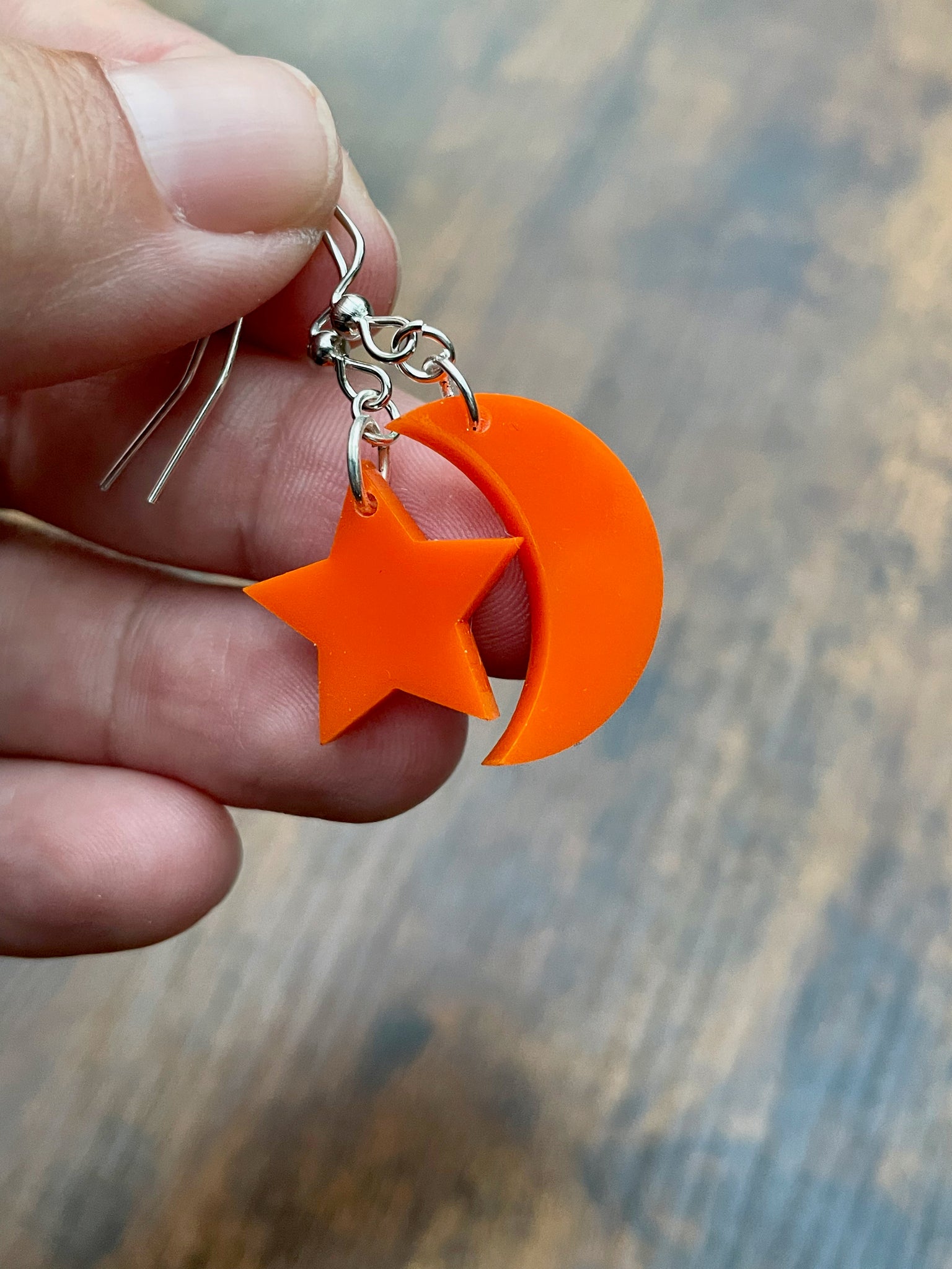 fluorescent orange moon and star earrings